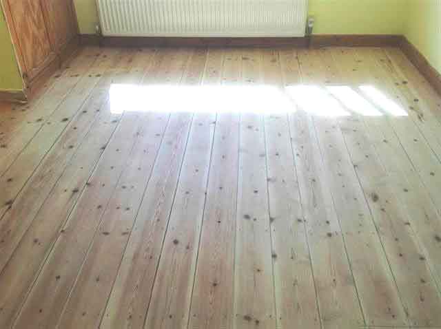 Mid sanding of wooden floor