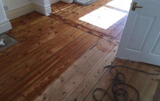 During wood floor sanding and oil finishing in Exeter home