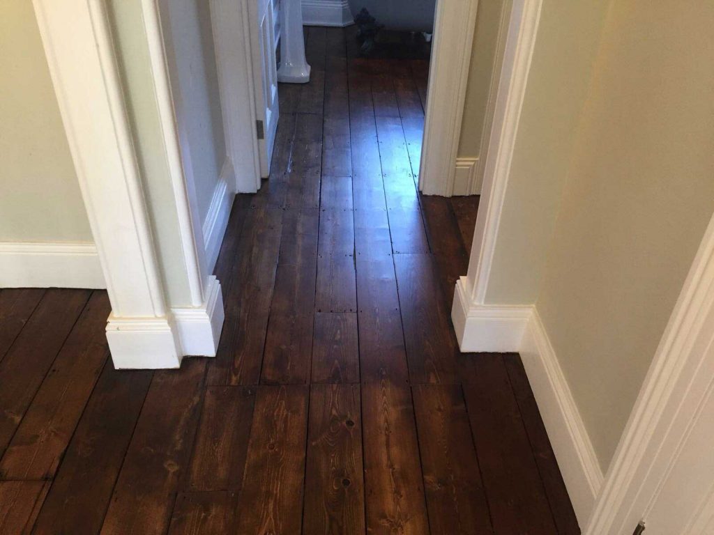 Devon property in Lustleigh has wooden floors restored which involved carpentry repairs, sanding, staining and finishing with lacquer