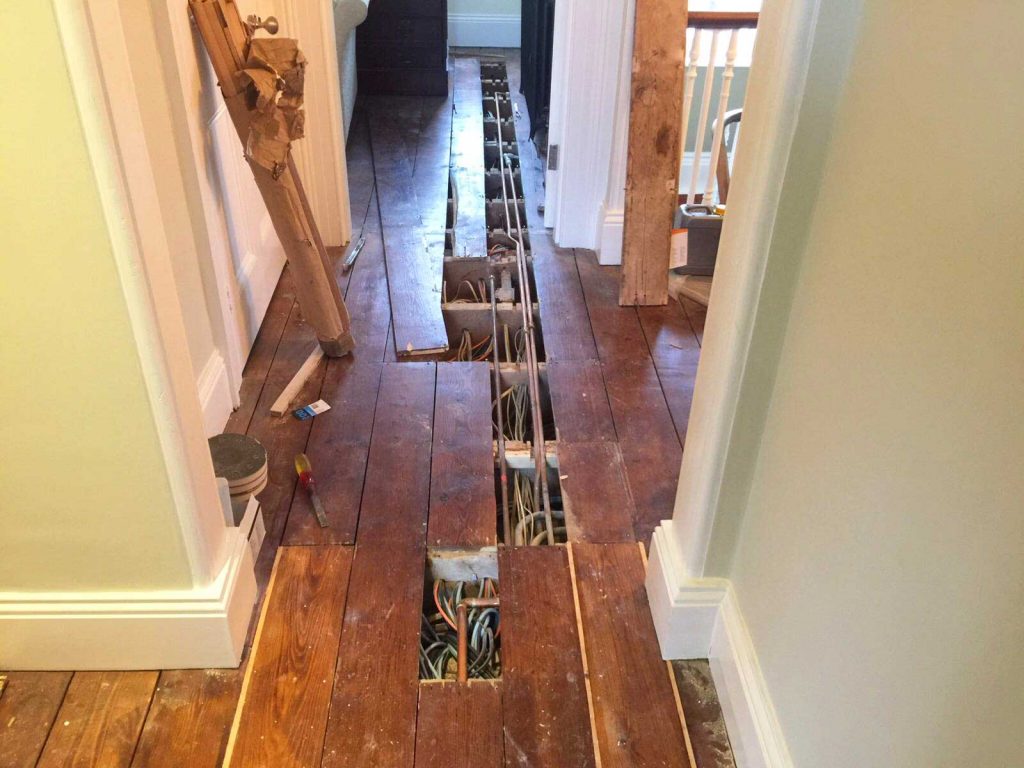 Repairing wooden floor boards in Devon home