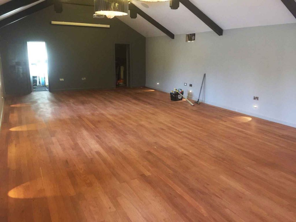 Sanding the wooden floor at Exeter Golf and Country Club