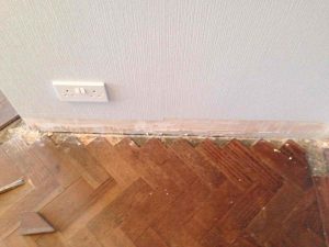 Repairs to edge of the wooden floor