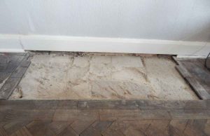 Repairs to wooden floor where fire place removed