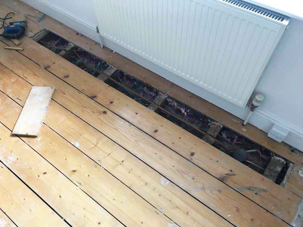 Pine wooden floor repairs in Torquay, Devon