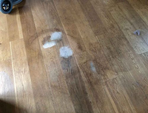 How do you remove red wine stains from a solid oak floor?